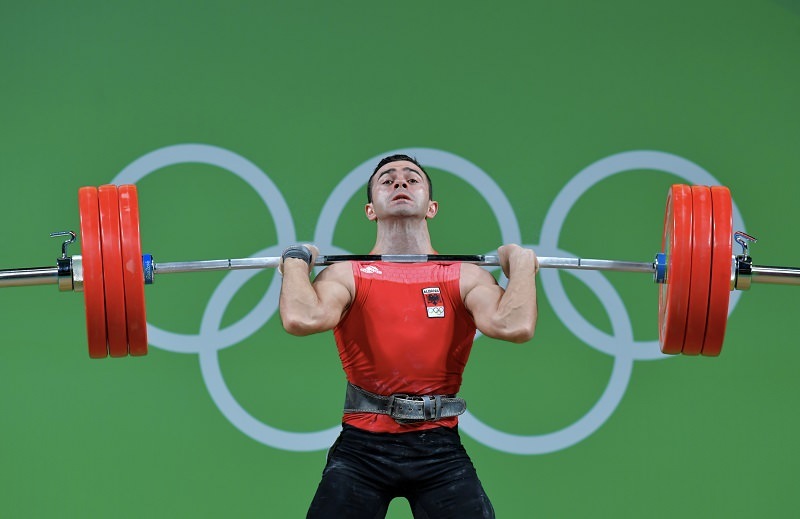 Olympic Weight Lifter with Olympic Rings